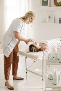 A Dermatologist Applying Facial Mask on Customer's Face